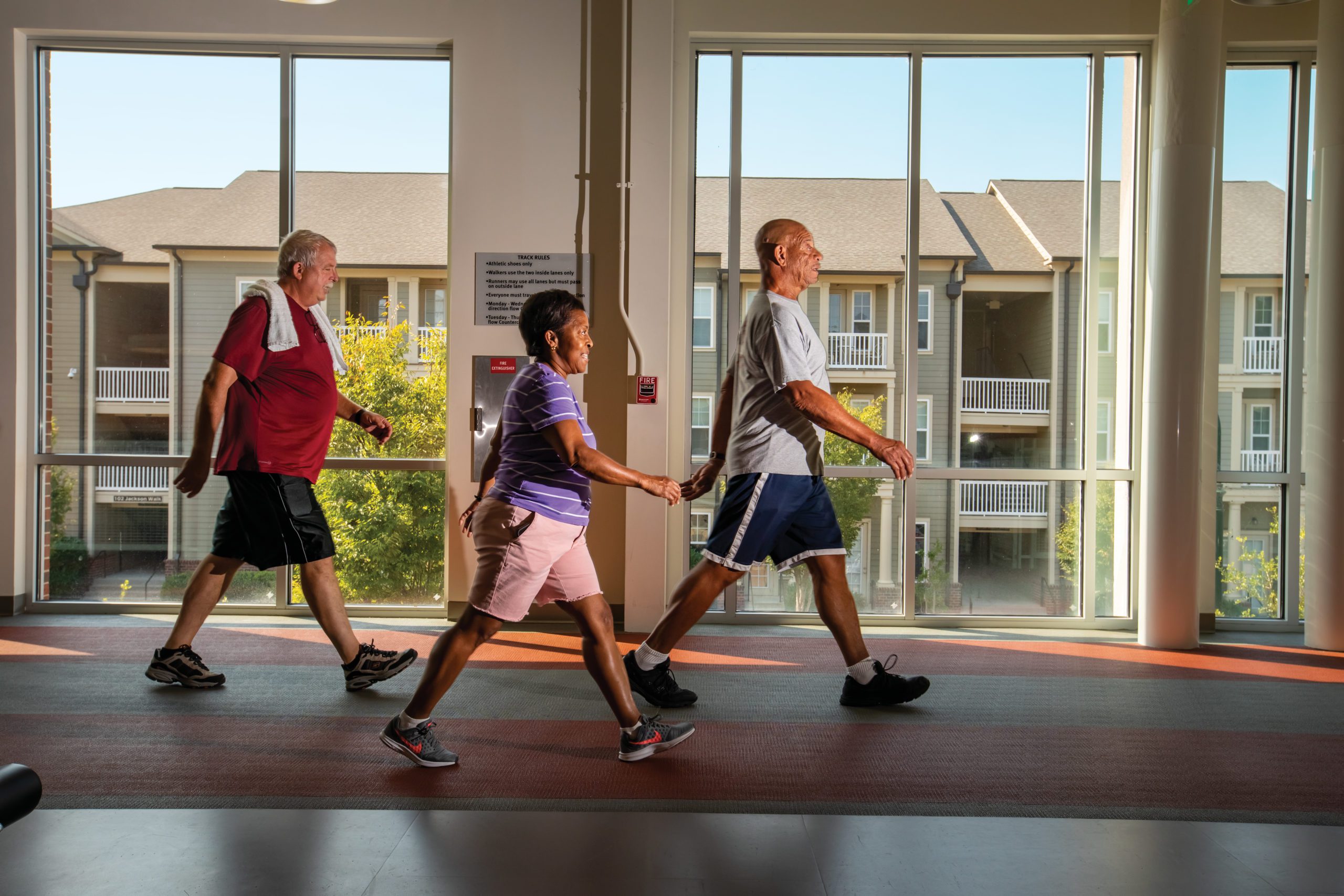 Sadie Robinson, center, and her husband Joe walk the track as they are followed by David Middlebrooks at the Lift Wellness Center in the Jackson Walk area near downtown Jackson. 
©Journal Communications/Nathan Lambrecht